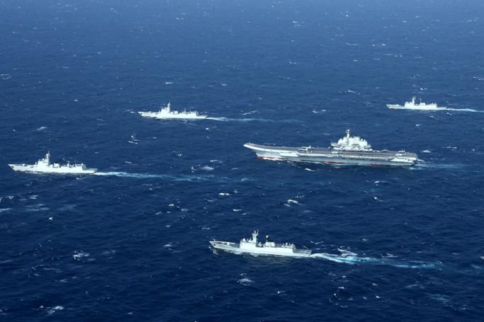 A Chinese navy formation, including the aircraft carrier Liaoning (C), during military drills in the South China Sea. Photo: AFP