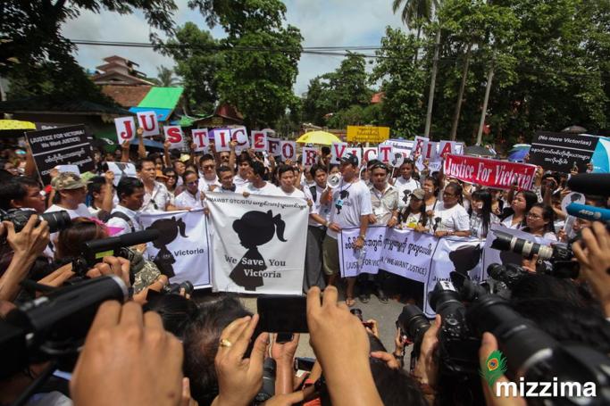 Protesters hold signs during the demonstration demanding for justice in a rape case in front of the Central Investigation Department (CID) in Yangon on July 6, 2019. Photo: Thura/Mizzima