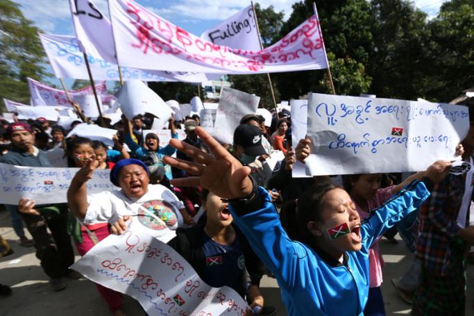 Demonstrators march in support of three local activists jailed by authorities during a rally in Myitkyina, capital of restive Kachin state on December 11, 2018. Photo: Zau Ring Hpra/AFP