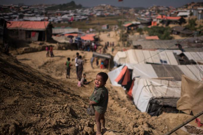 (FILES) In this file photo taken on November 29, 2017 a Rohingya Muslim refugee child cries as he stands near the Thyangkhali refugee camp at Cox's Bazar. Photo: Ed Jones/AFP