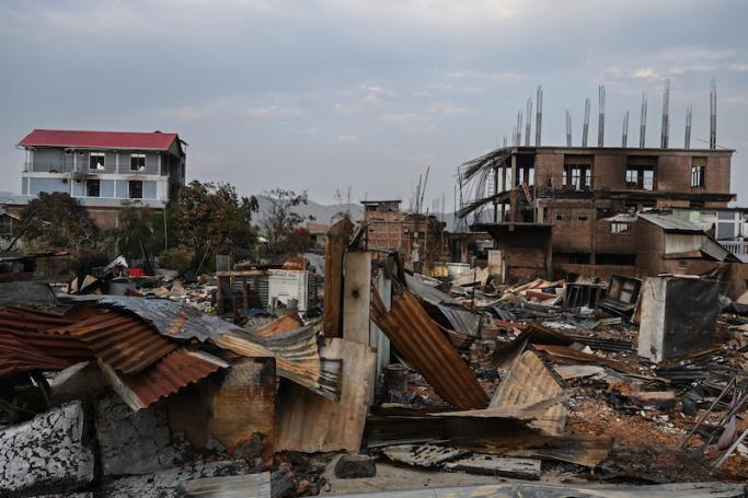 Houses that were set on fire and vandalised by mobs are seen in Khumujamba village on the outskirts of Churachandpur on May 9, 2023, in a violence hit area of the north-eastern Indian state of Manipur. Photo: AFP