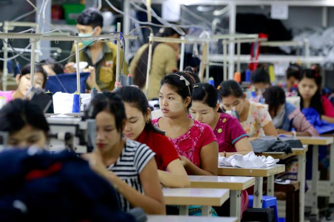 Employees work at a garment factory in Shwe Pyi Thar, Yangon, Myanmar. Photo: Nyein Chan Naing/EPA