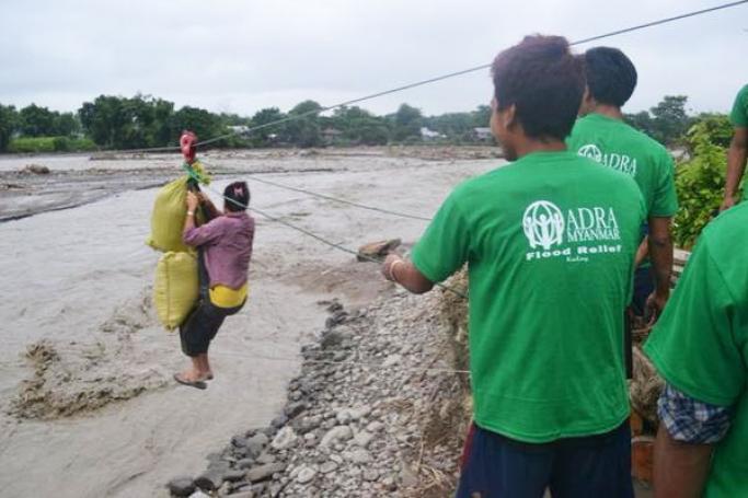 NGO staff and volunteers use zipline to transport emergency rice to villages in Kalaymyo in Sagaing. Photo: ADRA Myanmar
