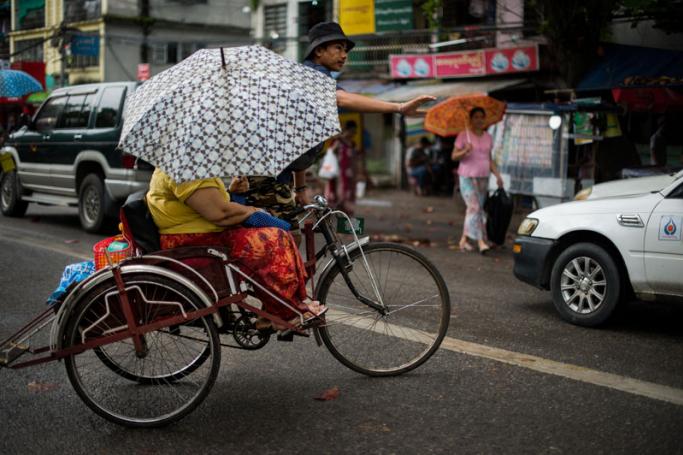 Trishaws are a regular aspect of Yangon city life. Photo: Roberto Schmidt/AFP
