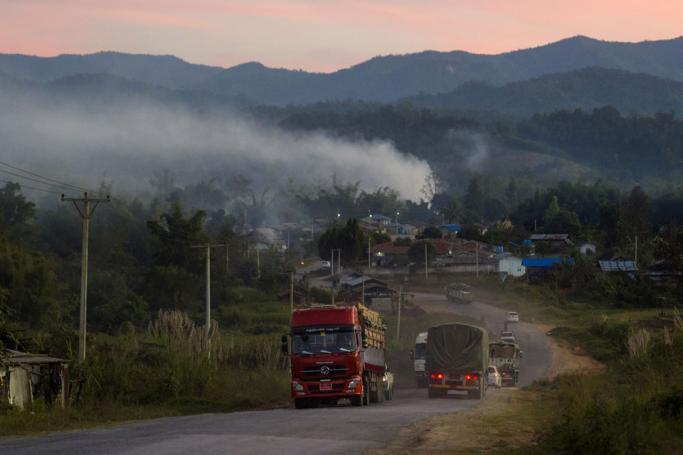 Trucks travelling along a road near Muse in Myanmar's Shan state, near the border to China. Photo: Ye Aung Thu/AFP