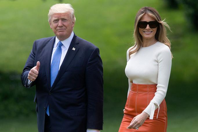 US President Donald J. Trump (L) and First Lady Melania Trump (R) walk on the South Lawn of the White House to depart by Marine One, in Washington, DC, USA, 19 May 2017. Trump departs for his first overseas trip as US President, with planned stops in Saudi Arabia, Israel, the Vatican, the NATO summit in Brussels and G7 summit in Taormina. Photo: Michael Reynolds/EPA
