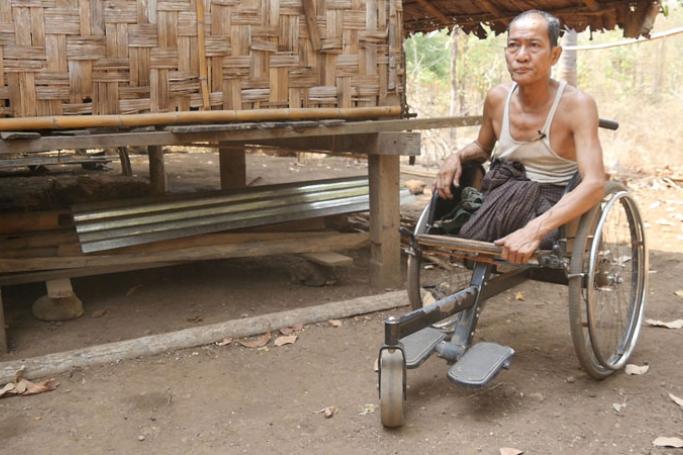 Kyar Khin, a farmer in Aung Chan Thar village in Kyaukkyi township in eastern Myanmar’s Kayin State, lost both his legs following a land mine injury. (Photo: David Doyle/Myanmar Now) 
