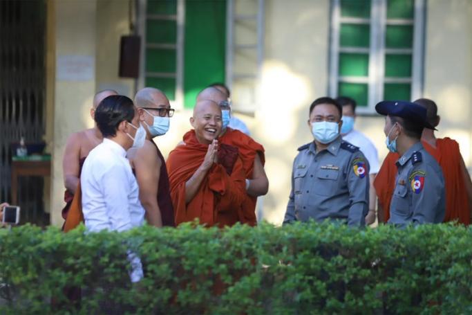 Myanmar nationalist Buddhist monk U Wirathu (C) greets supporters outside the Yangon western district police station in Yangon on November 2, 2020. Photo: Thura/Mizzima