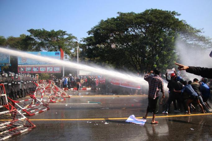 Police fire water cannon at demonstrators during a protest against the military coup, in Naypyitaw, Myanmar, 09 February 2021. Photo: EPA