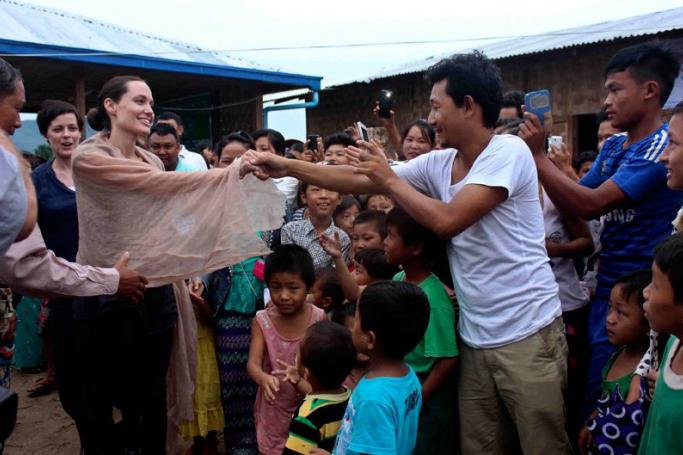US actress and UNHCR Goodwill Ambassador Angelina Jolie (C) greets with Kachin refugees at Janmai Baptist camp, Myitkyina, Kachin State, Myanmar, 30 July 2015. Angelina Jolie is on her six days visit to Myanmar as UNHCR Goodwill Ambassador. Angelina Jolie met Myanmar President and speakers of Myanmar Parliaments in Naypyitaw and also planned to visit IDPs camps during her visit. Photo: Myitkyina News Journal/EPA
