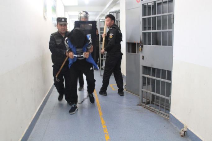 This undated handout image released by The Victims of Communism Memorial Foundation on May 24, 2022, shows police personnel engaged in an apparent anti-escape or anti-riot drill at the Tekes County Detention Centre in the Xinjiang Region of western China in February 2018. Photo: AFP