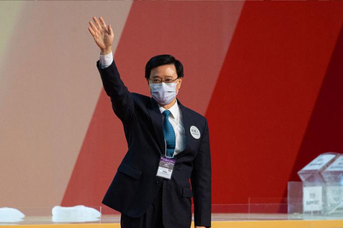 Hong Kong Chief Executive-elect John Lee Ka-chiu waves after being elected at the Exhibition and Convention Centre in Hong Kong, China, 08 May 2022. Photo: EPA