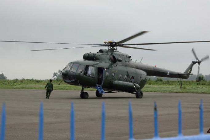 A military helicopter is seen in Sittwe Township in Rakhine state. Photo: EPA