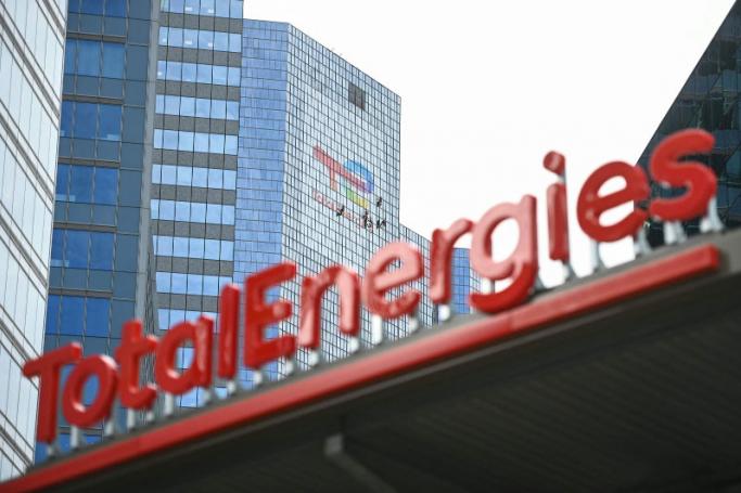 The new TotalEnergies logo is seen during its unveling ceremony, at a charging station in La Defense on the outskirts of Paris, France. Photo: AFP