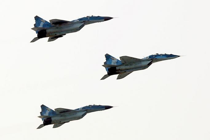 Russian MIG-29 fighter jets of the Myanmar Air Force fly in formation during a military parade in Naypyidaw on March 27, 2018 to mark the 73rd Armed Forces Day. (Photo by Thet AUNG / AFP)