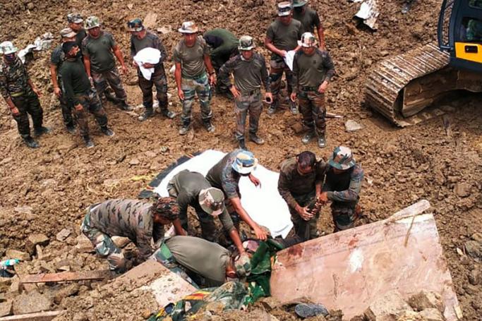 In this handout photo released by the Indian Army and taken on July 1, 2022, security forces and disaster relief teams search for survivors and victims after a landslide in Noney district, some 50 Km from Manipur's capital Imphal. Photo: AFP