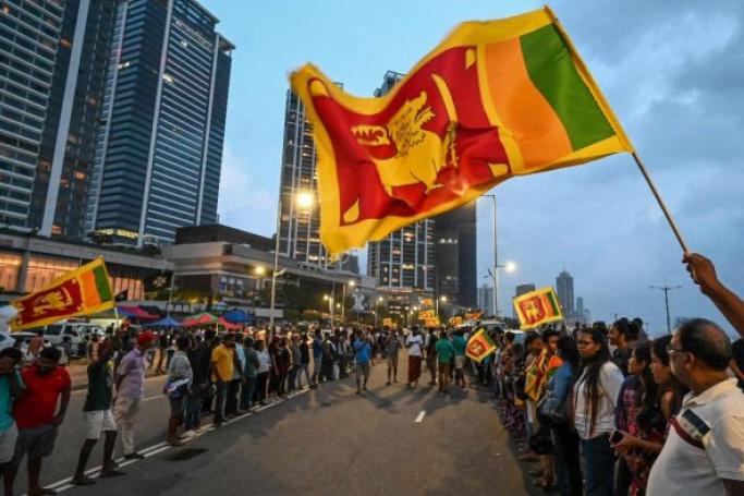 Anti-government demonstrators take part in a protest near the President's office in Colombo. Photo: AFP