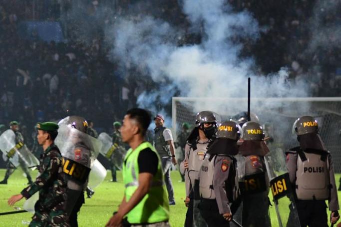 At least 125 people were killed in one of the deadliest disasters in the history of football, when officers fired tear gas in a packed stadium, triggering a stampede in Indonesia. Photo: AFP