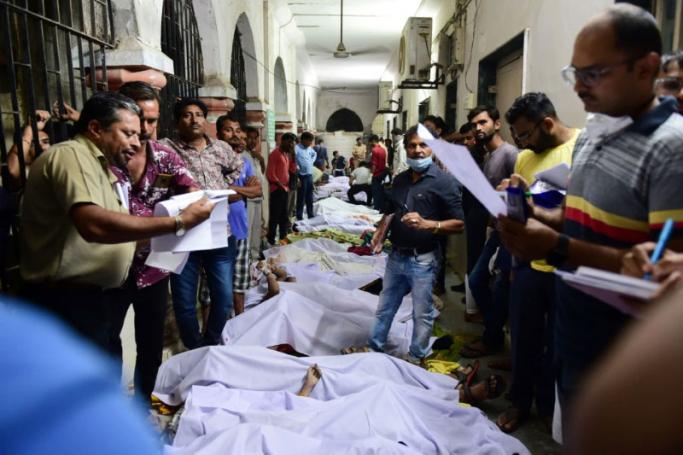 Bodies are seen on the floor of the government civil hospital after a bridge across the river Machchhu collapsed in Morbi, some 220 kms from Ahmedabad, early on October 31, 2022. Photo: AFP