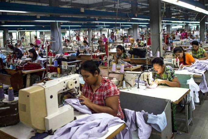This file photo shows workers at a garment factory in Yangon. Photo: AFP