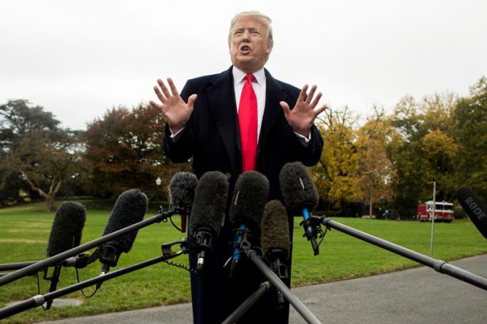 US President Donald J. Trump speaks to members of the news media before boarding Marine One on the South Lawn of the White House in Washington, DC, USA, 02 November 2018. Photo: Michael Reynolds/EPA