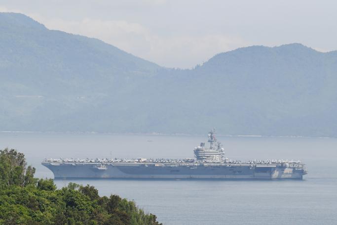 The USS Ronald Reagan, a US Navy Nimitz-class nuclear-powered aircraft carrier, pulls into port in Danang on June 25, 2023. Photo: AFP