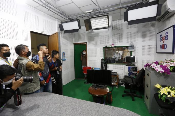 Photojournalists work inside the office of online media outlet Voice of Democracy (VOD) in Phnom Penh, Cambodia, 13 February, 2023. Photo: EPA