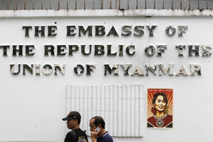 A poster showing Myanmar democracy icon Aung San Suu Kyi pasted to the wall of the Myanmar Embassy in Bangkok by protesters calling for the release of jailed journalists and political prisoners, in Bangkok, Thailand. Photo: EPA