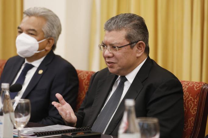 Malaysian Foreign Minister Saifuddin Abdullah (R) talks to his Vietnamese counterpart during a meeting at the Ministry of Foreign Affairs in Hanoi, Vietnam, 17 March 2022. Photo: EPA