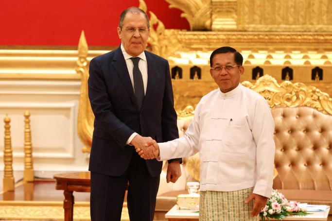 A handout photo made available by the press service of the Russian Foreign Affairs Ministry shows Russian Foreign Minister Sergei Lavrov (L) and Myanmar military Commander-in-Chief Senior General Min Aung Hlaing (R) shaking hands during a meeting in Naypyitaw, Myanmar, 03 August 2022.  Photo: EPA