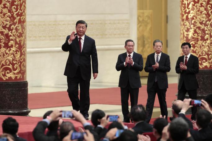 Chinese President Xi Jinping (L) leads the new members of the Standing Committee of the Political Bureau of the 20th Chinese Communist Party (CPC) Central Committee, Li Qiang (2-L), Zhao Leji (2-R), and Wang Huning (R) at a press conference at the Great Hall of People in Beijing, China, 23 October 2022. Photo: EPA