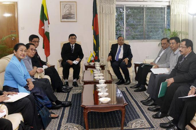 Bangladesh Foreign Minister Abul Hasan Mahmud Ali (centre R) sits next to Myanmar Social Welfare Minister Win Myat Aye (center L) during their meeting in Dhaka on April 12, 2018. Photo: AFP 
