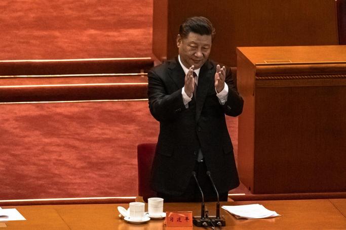 Chinese President Xi Jinping applauds during the conference marking the 70th anniversary of China's entry into the Korean war, at the Great Hall of the People, in Beijing, China, 23 October 2020. Photo: EPA
