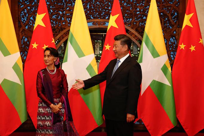 Chinese media gives visit the thumbs up - Myanmar State Counsellor Aung San Suu Kyi (L) and Chinese President Xi Jinping (R) wait for Myanmar delegates to enter for a meeting at the Diaoyutai State Guesthouse in Beijing, China, 19 August 2016. Photo: EPA

