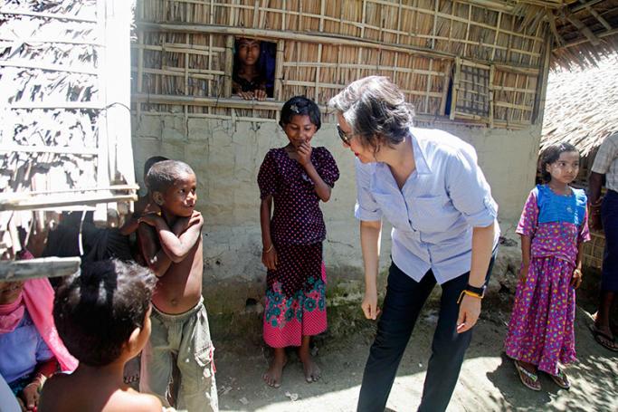 Yanghee Lee (C-L), the United Nations Special Rapporteur on the situation of human rights in Myanmar, talks with children in Kali Muslim village in Ponnagyun Township, Rakhine State, western Myanmar, 22 June 2016. Yanghee Lee is on her fourth visit to Myanmar and will stay from 19 June to 01 July 2016. Photo: Nyunt Win/EPA
