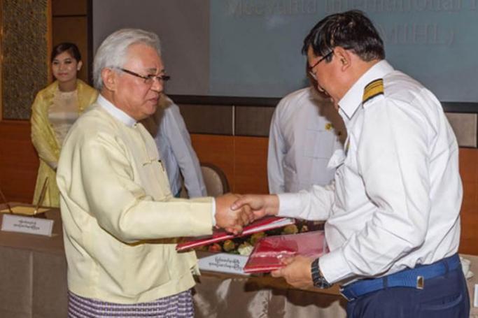U Theim Wai (Executive Chairman, Yoma Strategic) and U Thurein Win (Managing Director of Myanma Railways) exchanges signing books at the ceremony.
