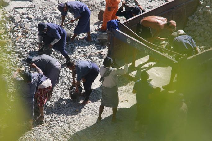 Prisoners are seen in Mon State’s Zin Kyeik Labour Camp quarry, manually breaking rocks while shackled at the legs. Photo: Swe Win / Myanmar Now
