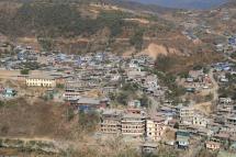 Residential houses are seen on the Myanmar's side near the border between India and Myanmar at Zokhawthar in the India's northeastern state of Mizoram on March 15, 2021. Sajjad HUSSAIN / AFP