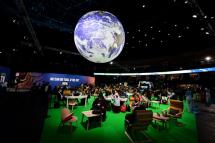 Delegates sit in the Action Zone as they attend the third day of the COP26 UN Climate Summit in Glasgow on November 3, 2021. Paul ELLIS / AFP