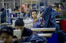 Employees work at the Shweyi Zabe garment factory in Shwe Pyi Thar Industrial Zone in Yangon. Photo: AFP