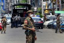 A soldier stands guard as security forces search for protesters, in Yangon on May 7. Photo: AFP