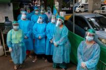 (File) Medical staff, nurses and volunteers wear protective gear amid concerns over the spread of the COVID-19 coronavirus as they prepare for going door-to-door for health check-ups in Yangon on May 17, 2020. Photo: Sai Aung Main/AFP