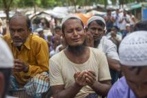 (File) Rohingya refugees pray as they take part in a protest held to mark the five year anniversary of the mass migration of Rohingya refugees from Myanmar to Bangladesh, at a makeshift camp in Kutubpalang, Ukhiya, Cox Bazar district, Bangladesh, 25 August 2022.
