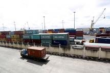 A truck carries a container at the Ahlone international terminal port in Yangon, Myanmar. Photo: Nyein Chan Naing/EPA
