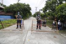 Myanmar police stand guard at a locked street in Sittwe, Rakhine State, western Myanmar, 20 August 2020. The Myanmar Health Ministry reports three more local transmissions of Covid-19 from Sittwe, Rakhine State, and a total of 396 cases in Myanmar. Health Ministry alerted citizens to prepare for a possible second COVID-19 wave. Photo: Nyunt Win/EPA