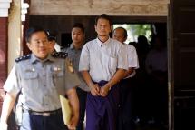 (File) Aung Win Zaw (C), suspect in the killing of Lawyer Ko Ni, is escorted by police as he arrives to the court in Yangon, Myanmar, 17 March 2017. Photo: Nyein Chan Naing/EPA
