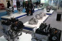 Visitors look at auto engines displayed at the Shanghai auto parts and service expo in Shanghai city, Chin. Photo: EPA