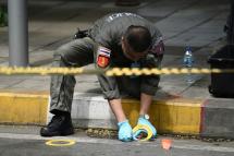 A policeman conducts an investigation at the scene of an explosion in Bangkok on August 2, 2019. Photo: Lillian Suwanrumpha/AFP