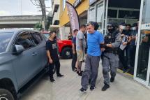 A handout picture released by Britain's National Crime Agency (NCA) in London on February 12, 2023 shows Richard Wakeling being arrested by members of the Royal Thai Police in Bangkok on February 10, 2023. Photo: AFP