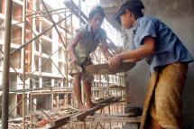 Child construction workers at work on a building site in Yangon. Photo: EPA